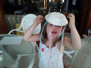 Lucy modeling her jellyfish hat.